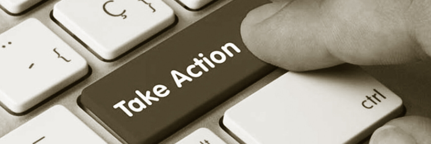 Fingure pressing Take Action button on keyboard