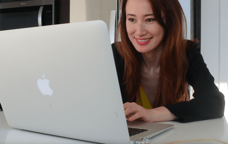 woman working on apple computer