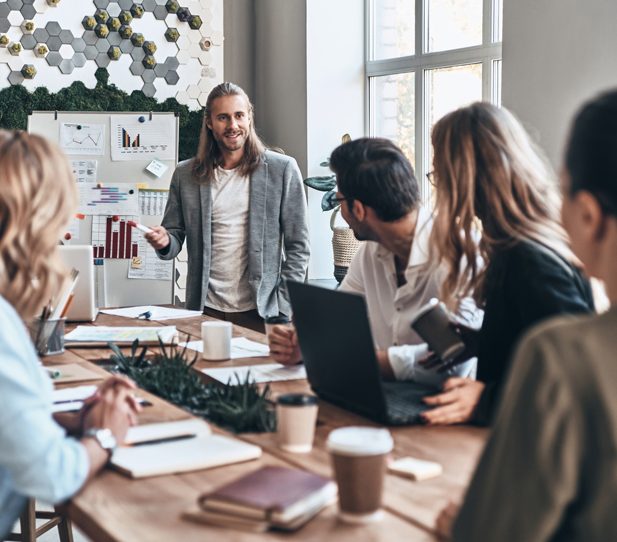 Working as team. Modern young man conducting a business presenta