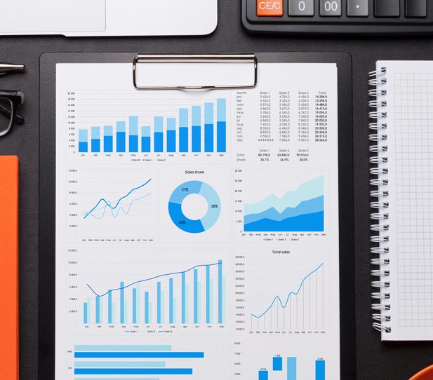 Weekly analytics check in | office workplace table with reports